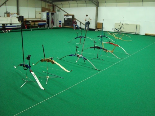 A row of bows behind the shooting line